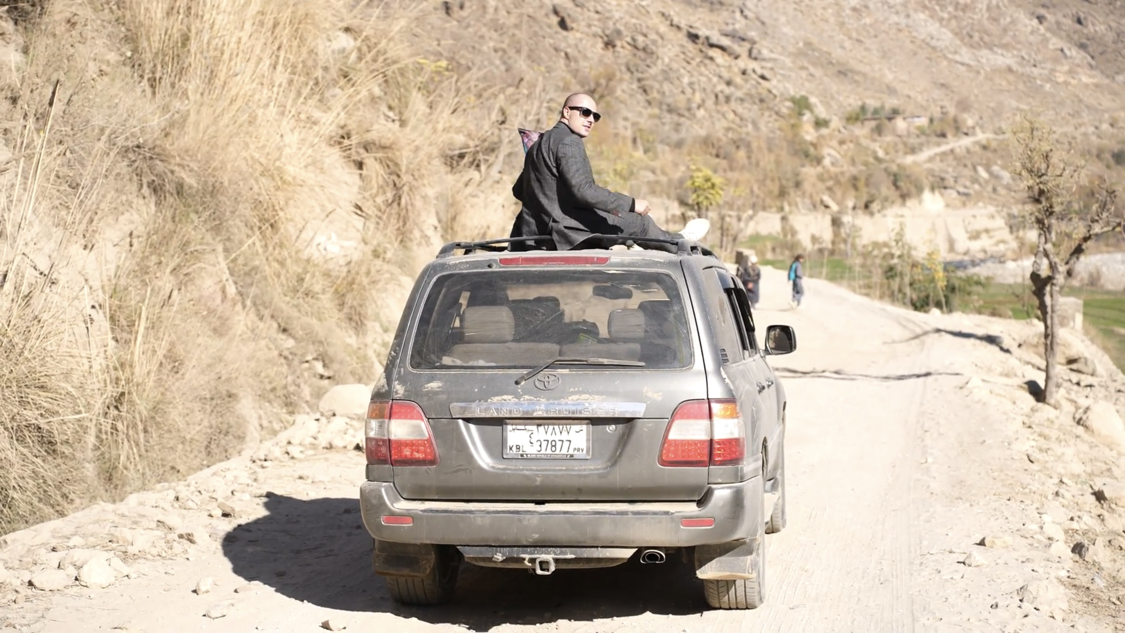 Lord Miles on a Land Cruiser in Afghanistan