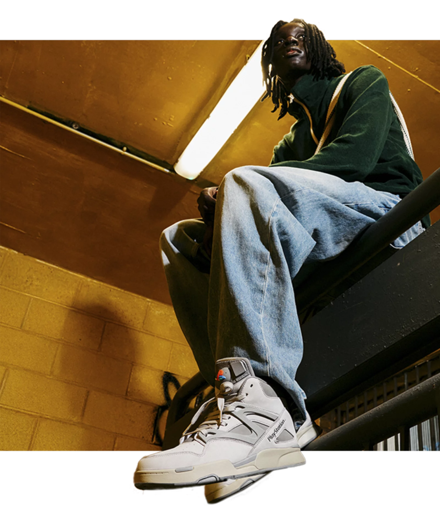 Model wearing PlayStation Reebok Pump Omni Zone II Sneakers