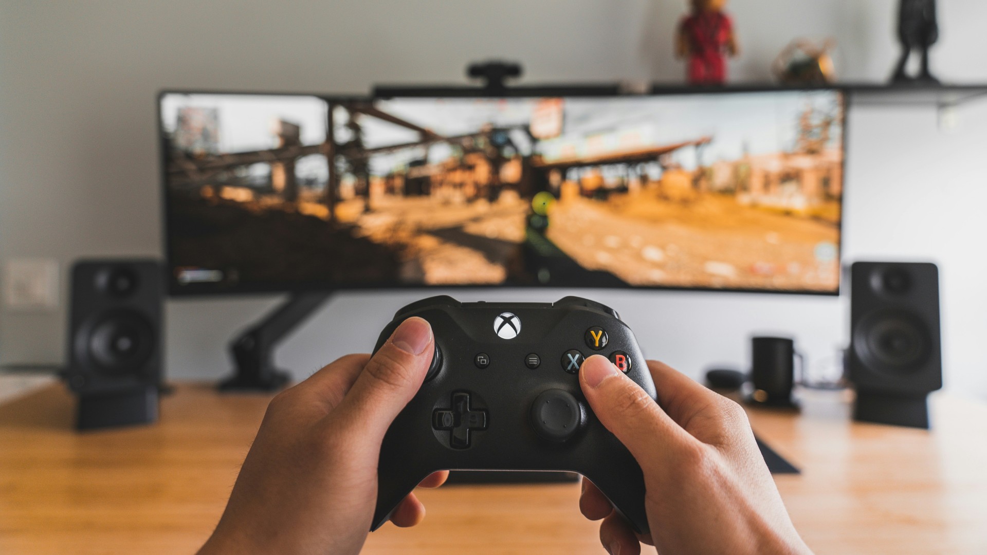 Man playing physical copy of an Xbox game