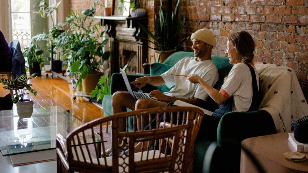 Man and woman setting up an eBay seller account